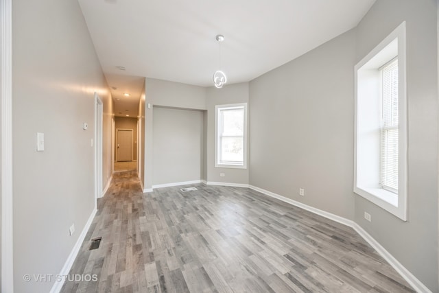 spare room with light wood-type flooring