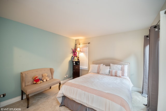 bedroom featuring light colored carpet