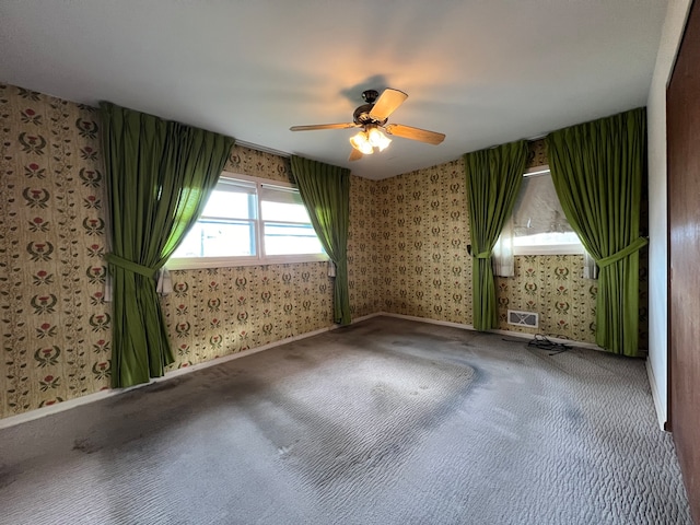 carpeted empty room with ceiling fan