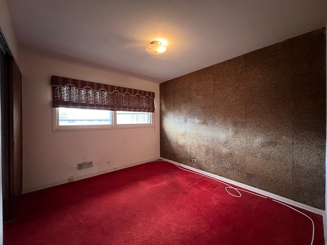 empty room featuring carpet floors