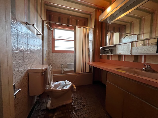 interior space featuring vanity, toilet, and shower / bathtub combination with curtain