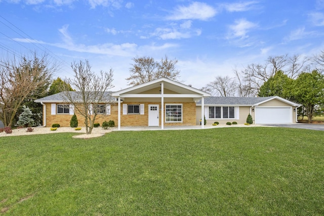 ranch-style house featuring a garage, a porch, and a front yard