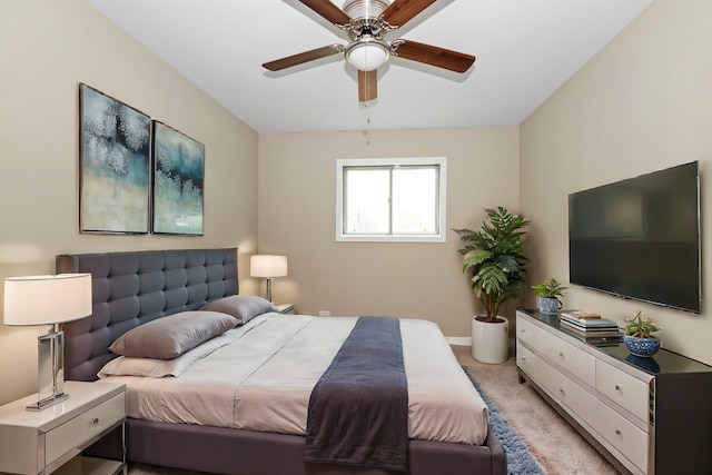 bedroom featuring ceiling fan and light carpet