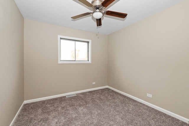 spare room featuring carpet flooring and ceiling fan