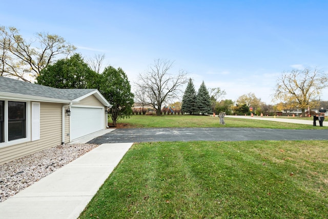 view of yard featuring a garage