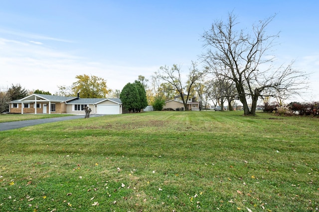 view of yard featuring a garage