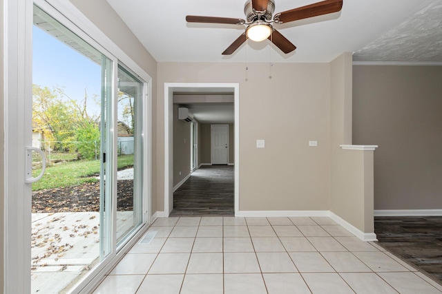 interior space with an AC wall unit, ceiling fan, crown molding, and light hardwood / wood-style floors