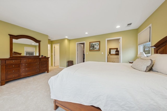 bedroom featuring light carpet