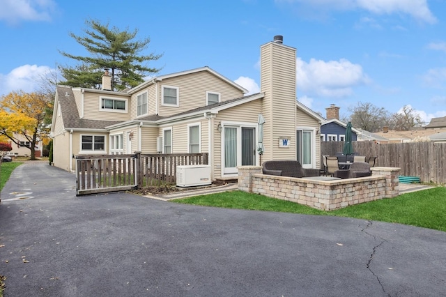 back of house with a patio