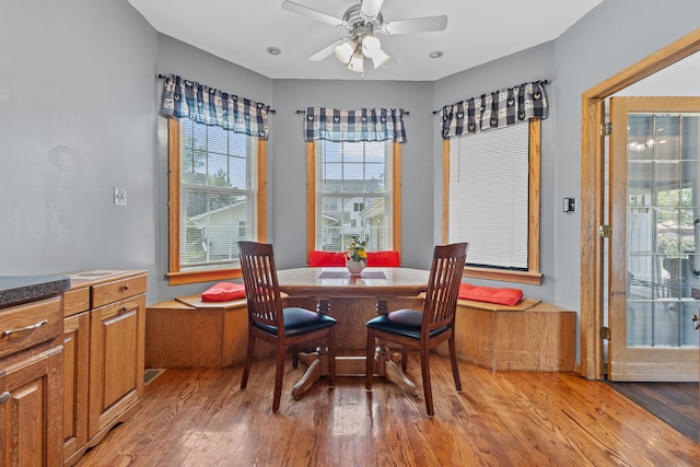 dining room with light wood-type flooring and ceiling fan