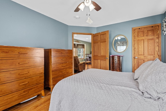 bedroom featuring ceiling fan and hardwood / wood-style flooring