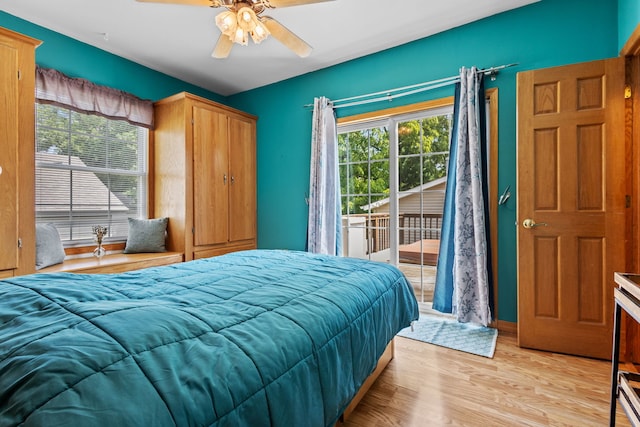 bedroom with access to outside, multiple windows, ceiling fan, and light hardwood / wood-style flooring