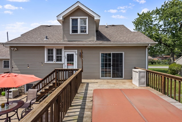 back of house featuring a wooden deck