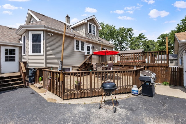 rear view of house with a wooden deck