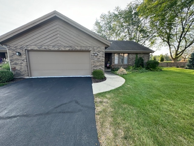 ranch-style house with a front lawn and a garage