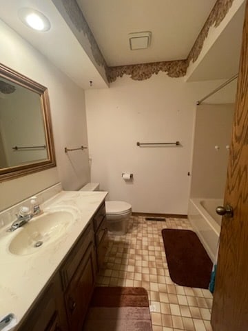 full bathroom featuring tile patterned flooring, vanity, toilet, and bathtub / shower combination