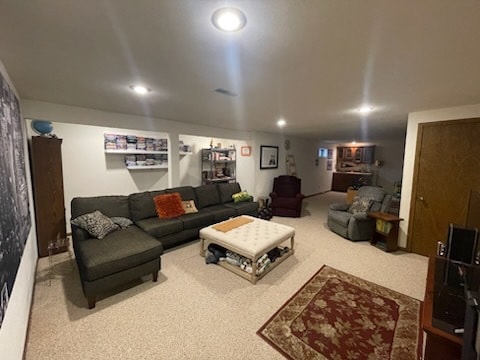 living room featuring carpet flooring