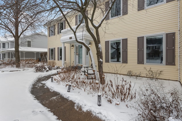 view of snow covered property