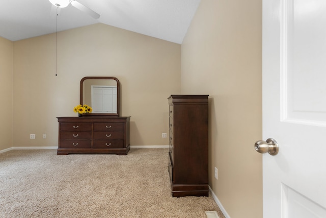 bedroom featuring ceiling fan, light carpet, and lofted ceiling