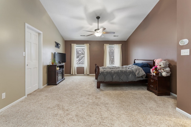 bedroom with ceiling fan, light colored carpet, and lofted ceiling