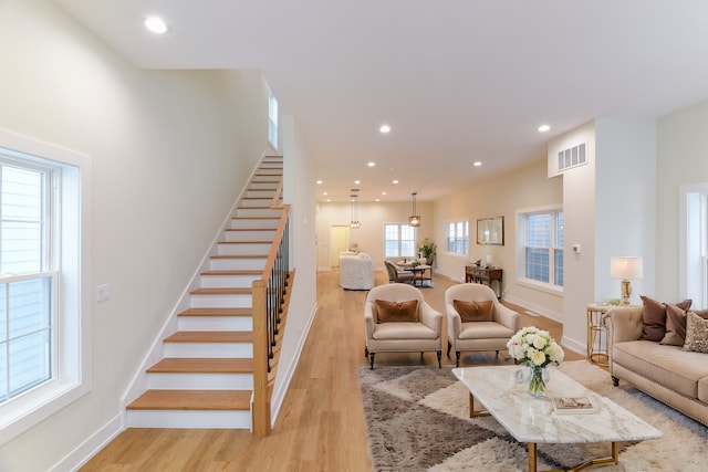 living room with light hardwood / wood-style flooring