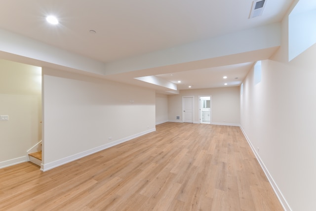 basement featuring light hardwood / wood-style floors