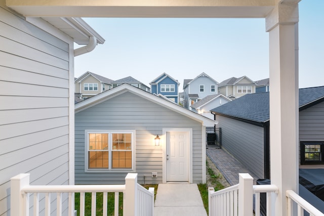 property entrance with covered porch