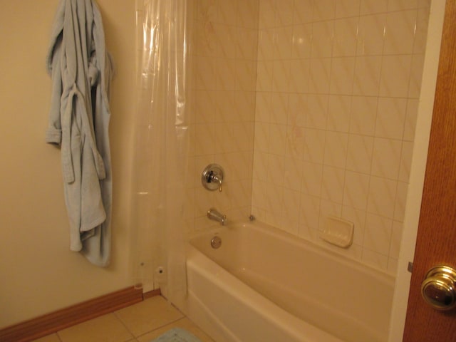 bathroom featuring tile patterned flooring and shower / bath combination with curtain