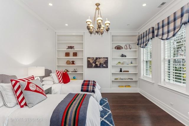 bedroom with baseboards, wood finished floors, visible vents, and crown molding