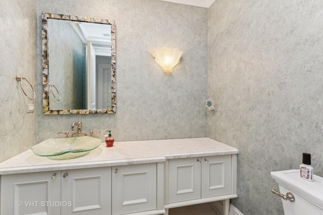 bathroom featuring toilet and vanity