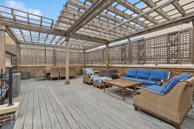 deck featuring outdoor lounge area and a pergola