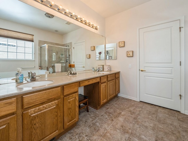 bathroom featuring vanity and an enclosed shower