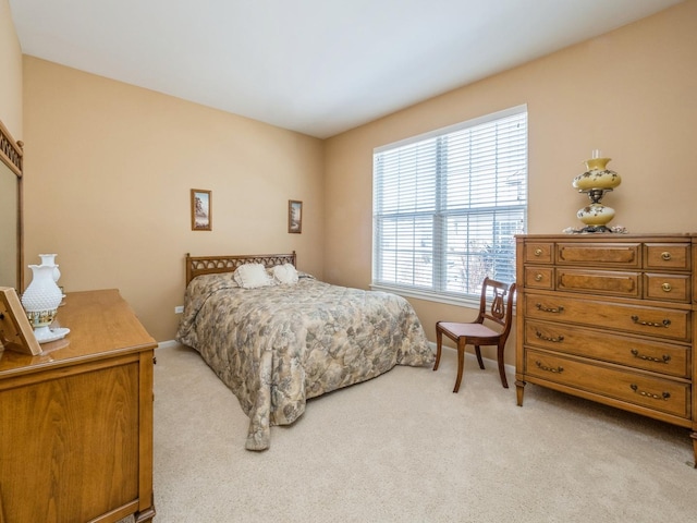 bedroom with light carpet