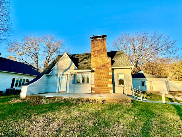 rear view of house featuring a yard and a patio area