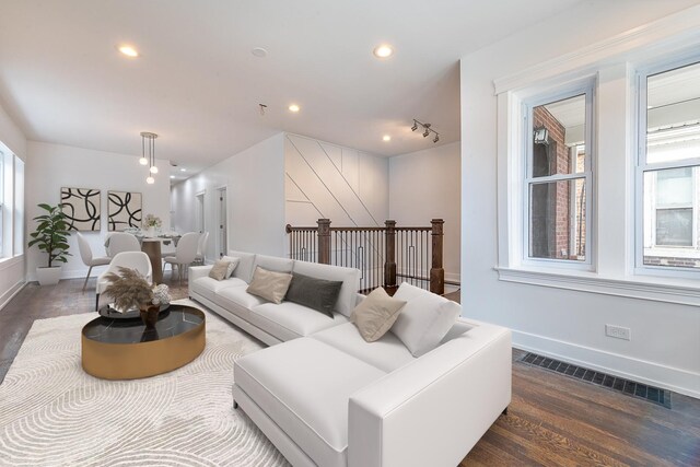 living room with dark hardwood / wood-style floors