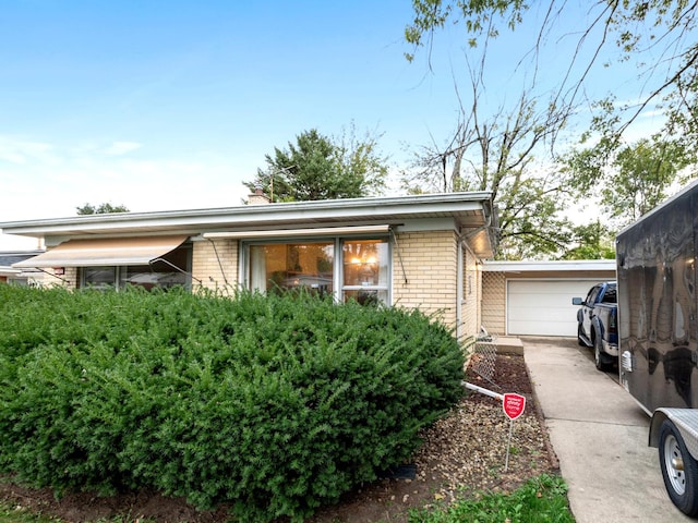 view of side of home featuring a garage