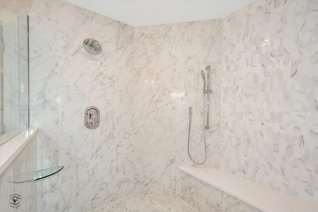 bathroom featuring a tile shower