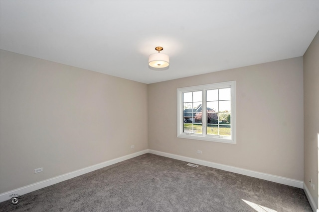 spare room featuring carpet flooring