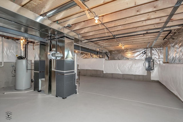 basement featuring electric panel, heating unit, and water heater