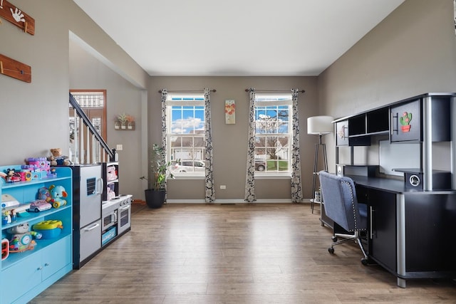 home office with wood-type flooring