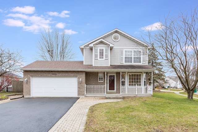 front of property featuring a front yard, a porch, and a garage