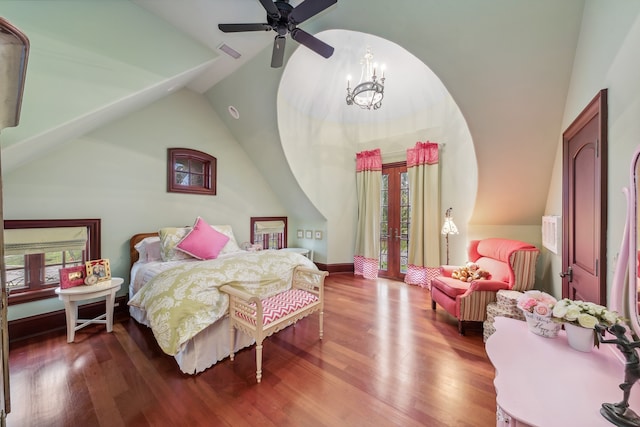 bedroom featuring lofted ceiling, ceiling fan with notable chandelier, and hardwood / wood-style flooring