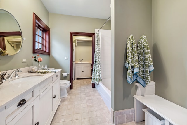 full bathroom with tile patterned flooring, vanity, shower / tub combo, and toilet