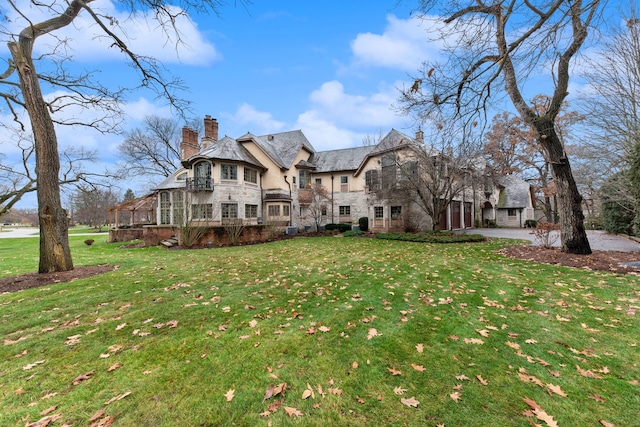 back of house with a yard