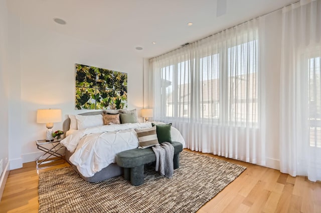 bedroom with light hardwood / wood-style flooring