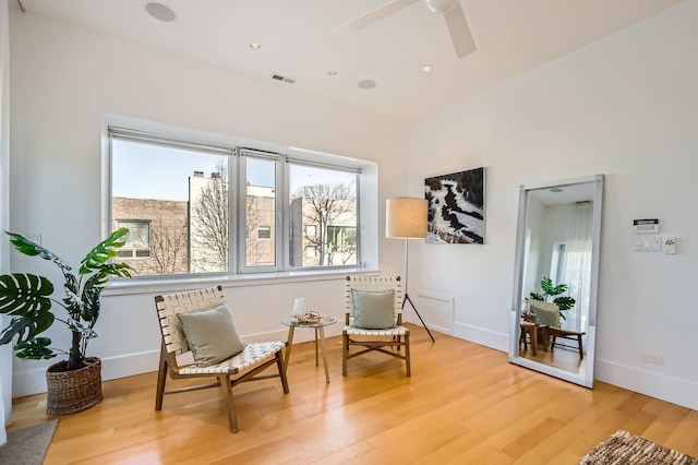 sitting room featuring hardwood / wood-style flooring and ceiling fan