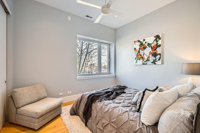 bedroom featuring ceiling fan and light hardwood / wood-style floors