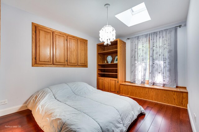 8542 W 132nd Pl, Palos Park, IL 60464 - bedroom featuring a chandelier, a skylight, dark wood finished floors, and baseboards
