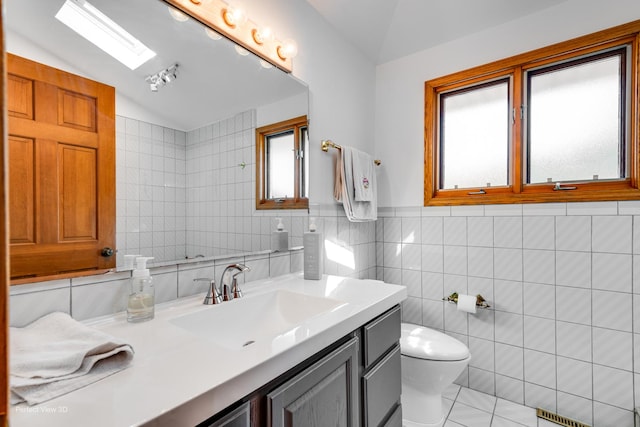 8542 W 132nd Pl, Palos Park, IL 60464 - bathroom with vaulted ceiling, tile walls, vanity, and toilet