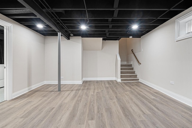 basement featuring light hardwood / wood-style floors